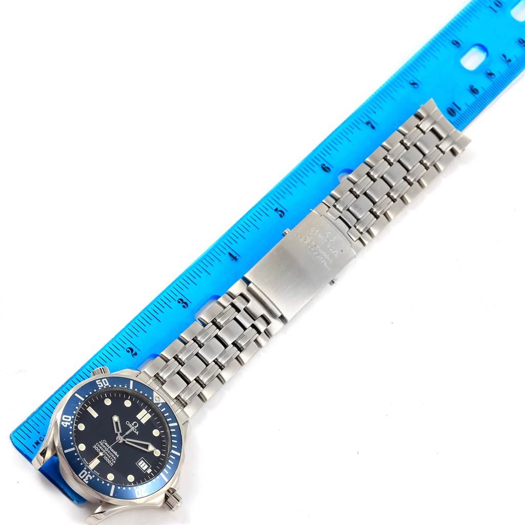 The image shows the Omega Seamaster 2531.80.00 Men
s Stainless Steel Blue Dial 2531.80.00 Men
s Stainless Steel Blue Dial watch from a top-down angle, including the face, bezel, and metal bracelet, measured against a blue ruler.