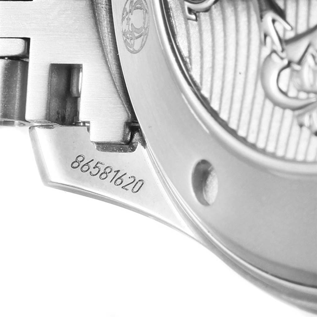 The image shows part of the back case and bracelet attachment of an Omega Seamaster 212.30.41.20.03.001 Men
s Stainless Steel Blue Dial 212.30.41.20.03.001 Men
s Stainless Steel Blue Dial watch, focusing on the partial serial number "86581620."