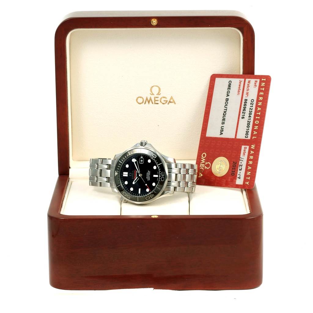The image shows an Omega Seamaster 212.30.41.20.01.003 Men
s Stainless Steel Black Dial 212.30.41.20.01.003 Men
s Stainless Steel Black Dial watch with a silver band, presented in a wooden box with an international warranty card inside.