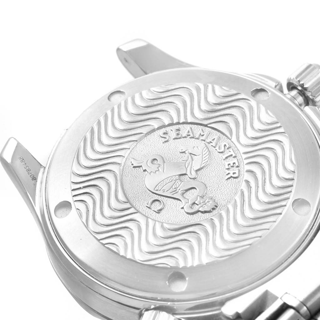 The image shows the back case of the Omega Seamaster 2252.50.00 Men
s Stainless Steel Black Dial 2252.50.00 Men
s Stainless Steel Black Dial watch, highlighting its engraved design and wavy pattern.