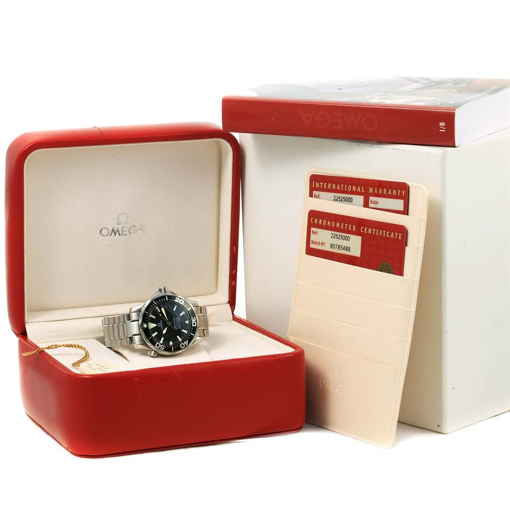The image shows an Omega Seamaster 2252.50.00 Men
s Stainless Steel Black Dial 2252.50.00 Men
s Stainless Steel Black Dial watch in its box, accompanied by the international warranty and chronometer certificate.