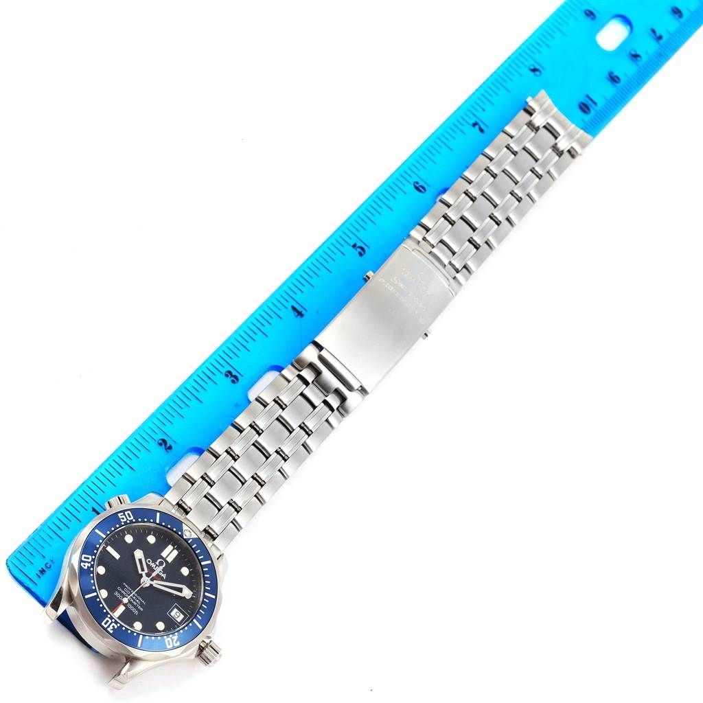 The image shows an Omega Seamaster 2222.80.00 Men
s Stainless Steel Blue Dial 2222.80.00 Men
s Stainless Steel Blue Dial watch laid flat next to a blue ruler, displaying the face, bezel, and bracelet.