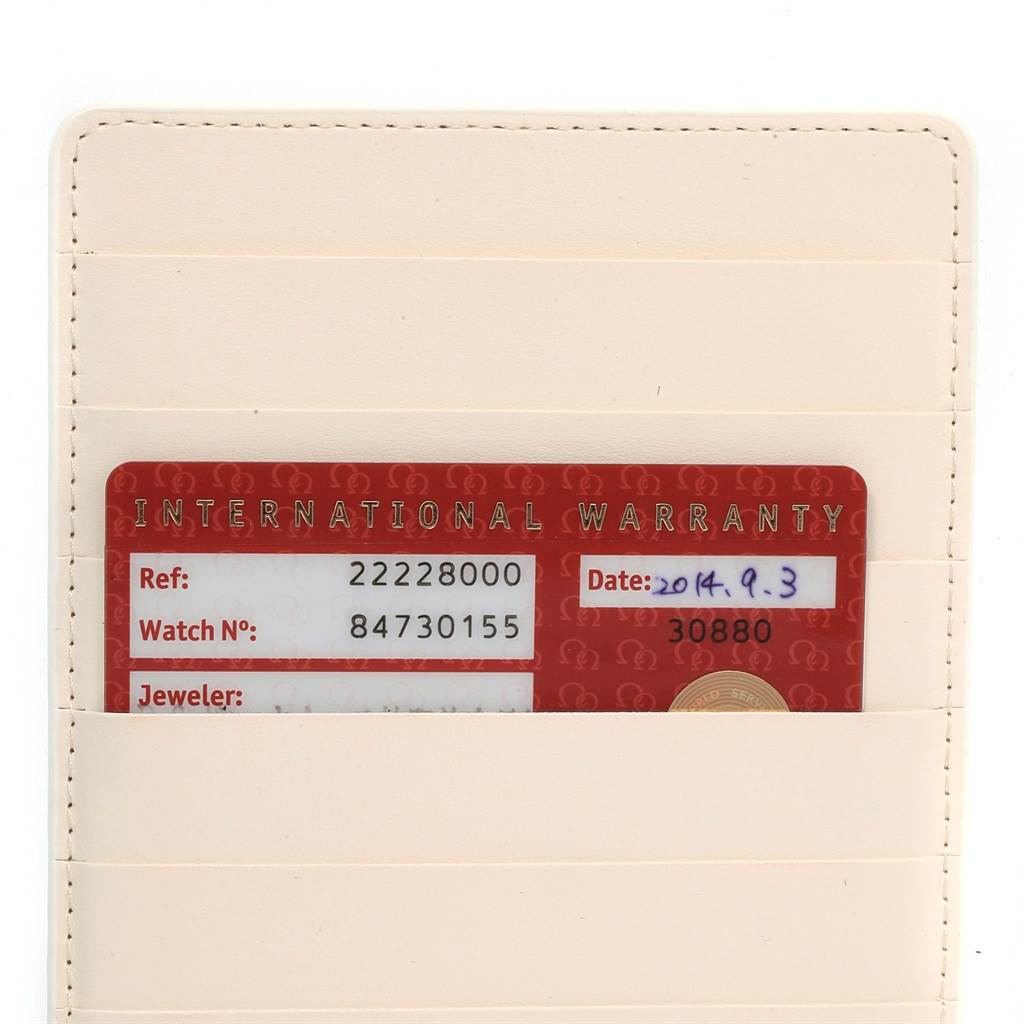 The image shows an international warranty card for an Omega Seamaster 2222.80.00 Men
s Stainless Steel Blue Dial 2222.80.00 Men
s Stainless Steel Blue Dial watch, placed inside a cream-colored holder.