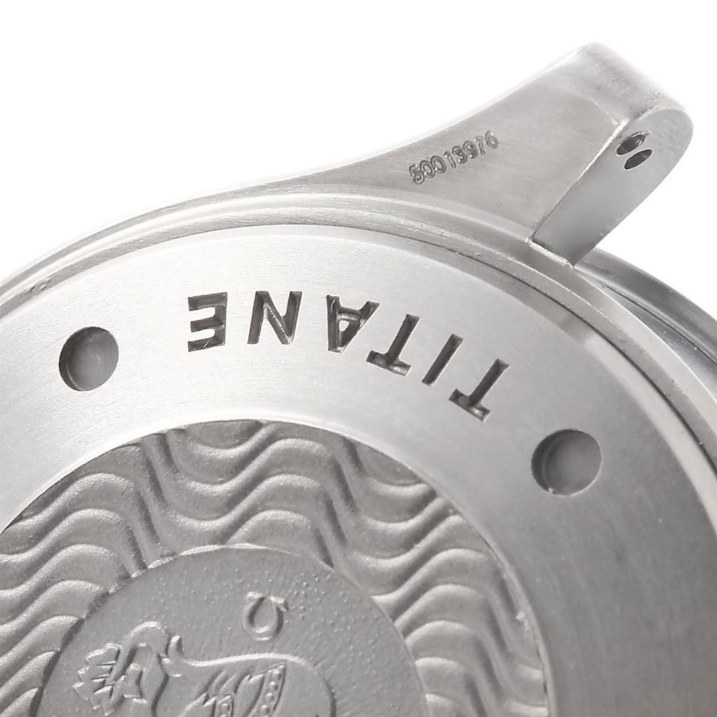 The image shows the case back of an Omega Seamaster 2296.80.00 Titanium Blue Dial 2296.80.00 Titanium Blue Dial watch, highlighting the engraving and textured pattern.