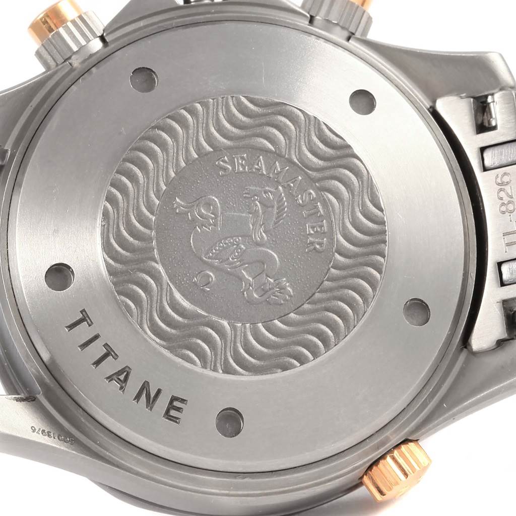 The image shows the back of an Omega Seamaster 2296.80.00 Titanium Blue Dial 2296.80.00 Titanium Blue Dial watch, highlighting its titanium case and engraved medallion.