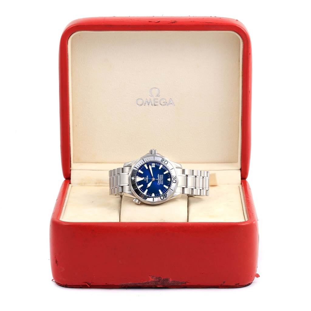 The Omega Seamaster 2554.80.00 Men
s Stainless Steel Blue Dial 2554.80.00 Men
s Stainless Steel Blue Dial watch is shown from the front, displayed in its red case with a blue dial and silver bracelet.