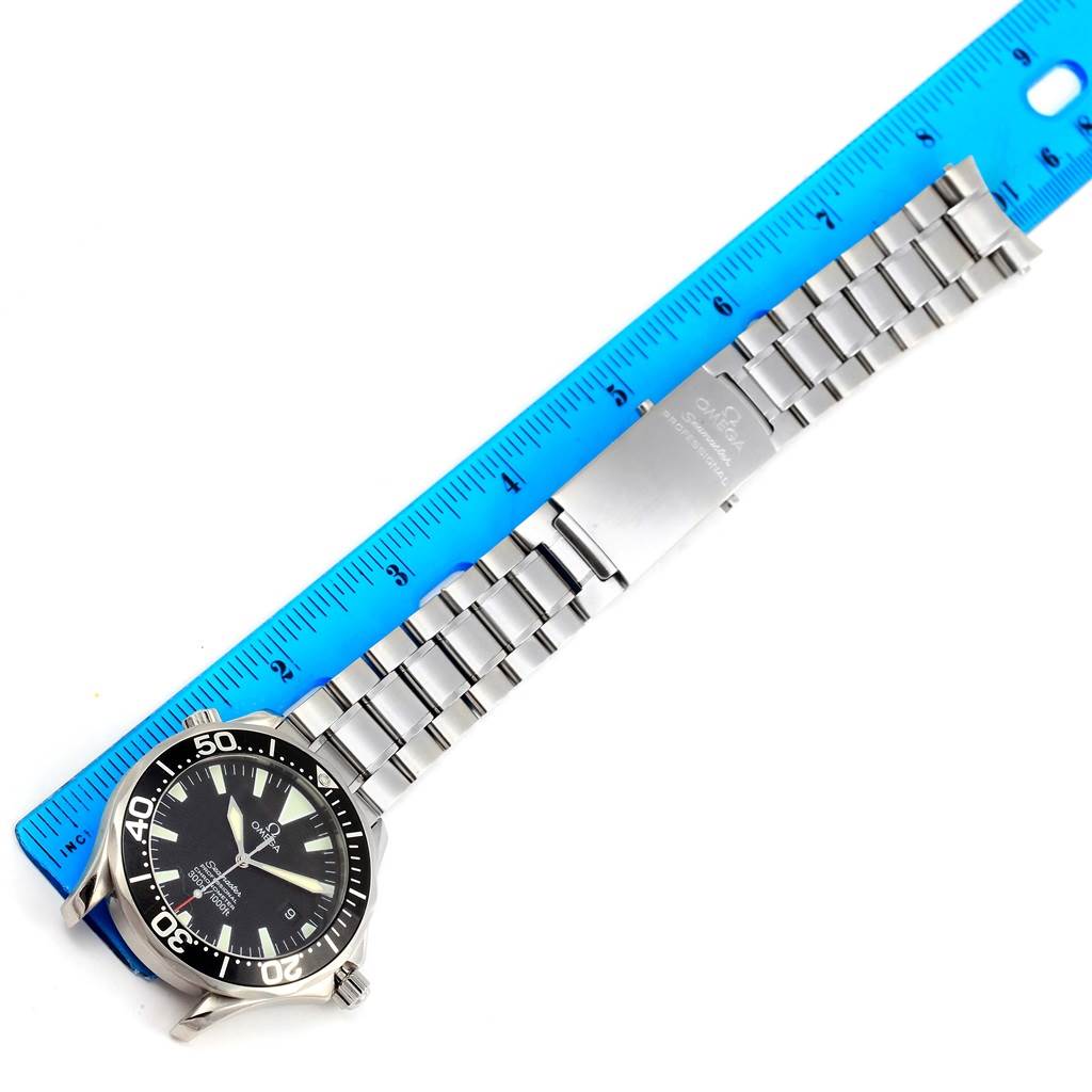 The image shows an Omega Seamaster 2254.50.00 Men
s Stainless Steel Black Dial 2254.50.00 Men
s Stainless Steel Black Dial watch laid flat next to a ruler, highlighting the face, bezel, and bracelet.