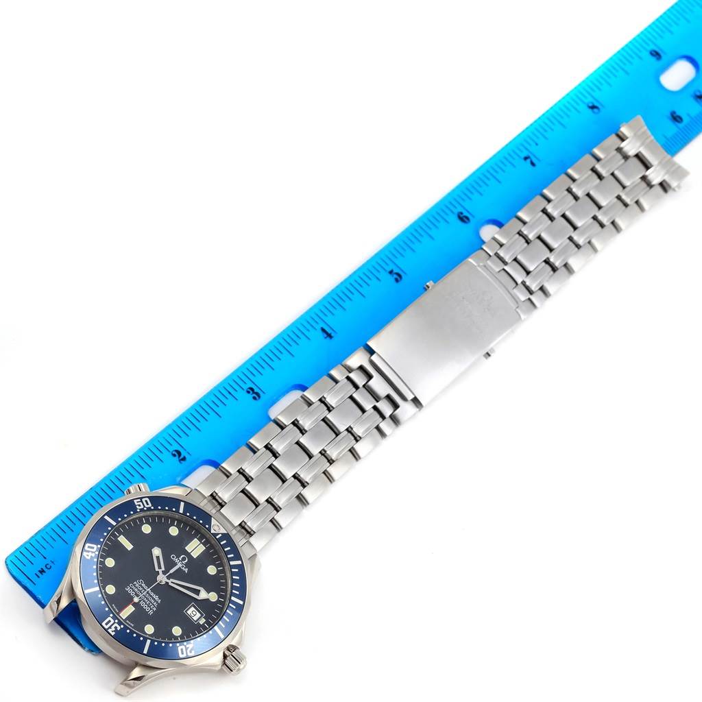 The image shows an Omega Seamaster 2531.80.00 Men
s Stainless Steel Blue Dial 2531.80.00 Men
s Stainless Steel Blue Dial watch laid flat next to a blue ruler, displaying its face and metal bracelet.