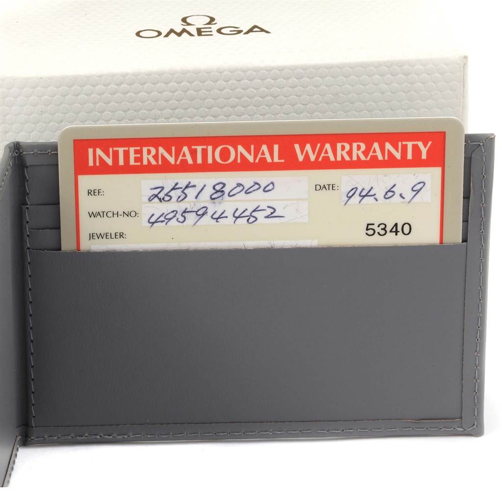 The image shows the warranty card and packaging for an Omega Seamaster 2551.80.00 Men
s Stainless Steel Blue Dial 2551.80.00 Men
s Stainless Steel Blue Dial watch.