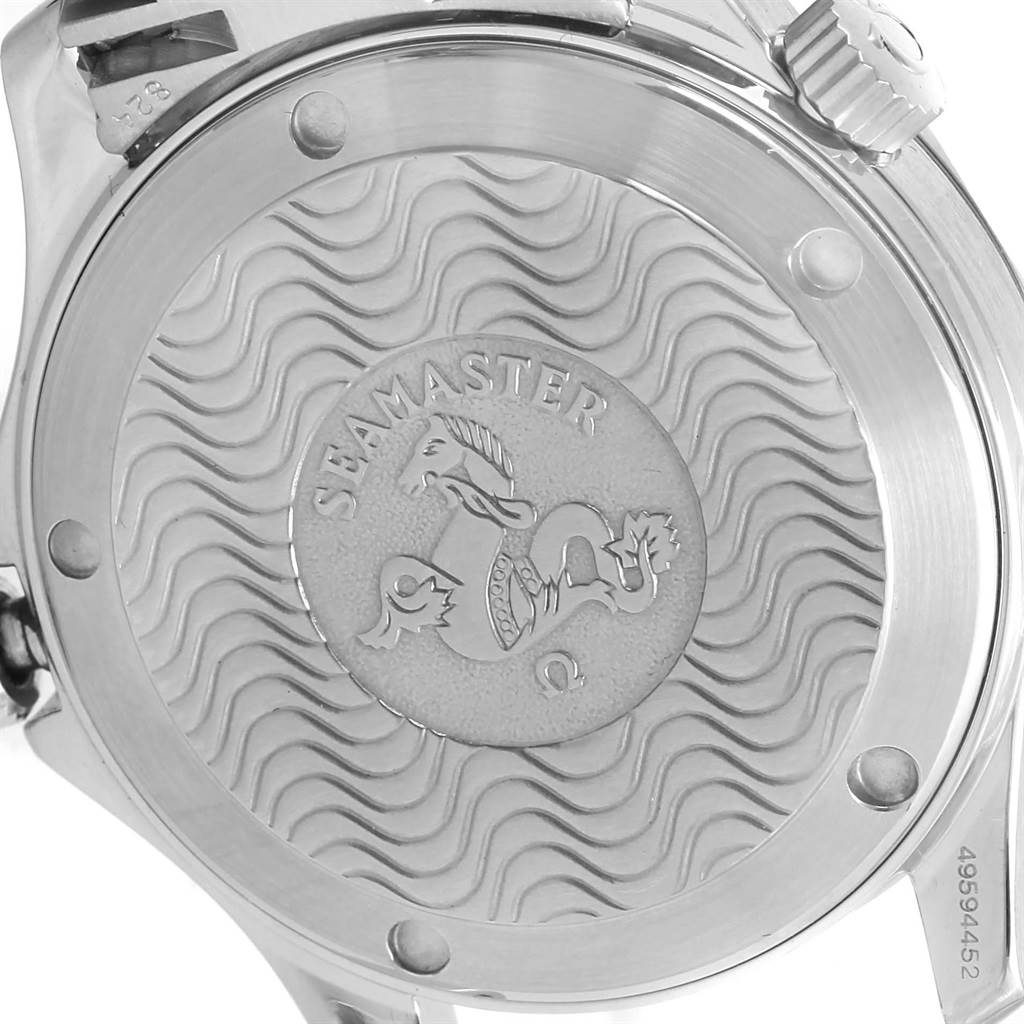 The image shows the back case of an Omega Seamaster 2551.80.00 Men
s Stainless Steel Blue Dial 2551.80.00 Men
s Stainless Steel Blue Dial watch with engravings and wave patterns.