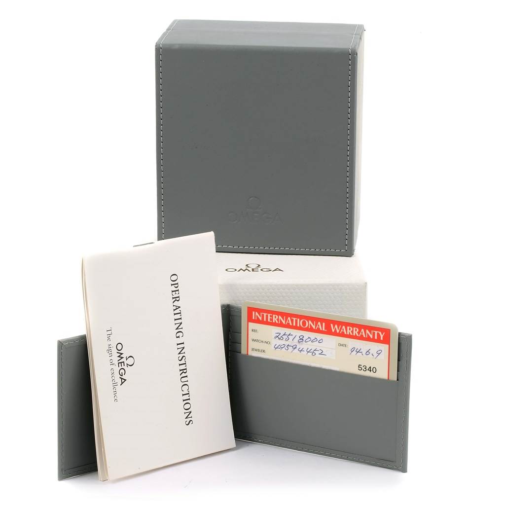 The image shows accessories for the Omega Seamaster 2551.80.00 Men
s Stainless Steel Blue Dial 2551.80.00 Men
s Stainless Steel Blue Dial watch, including a grey box, warranty card holder, and operating instructions booklet.