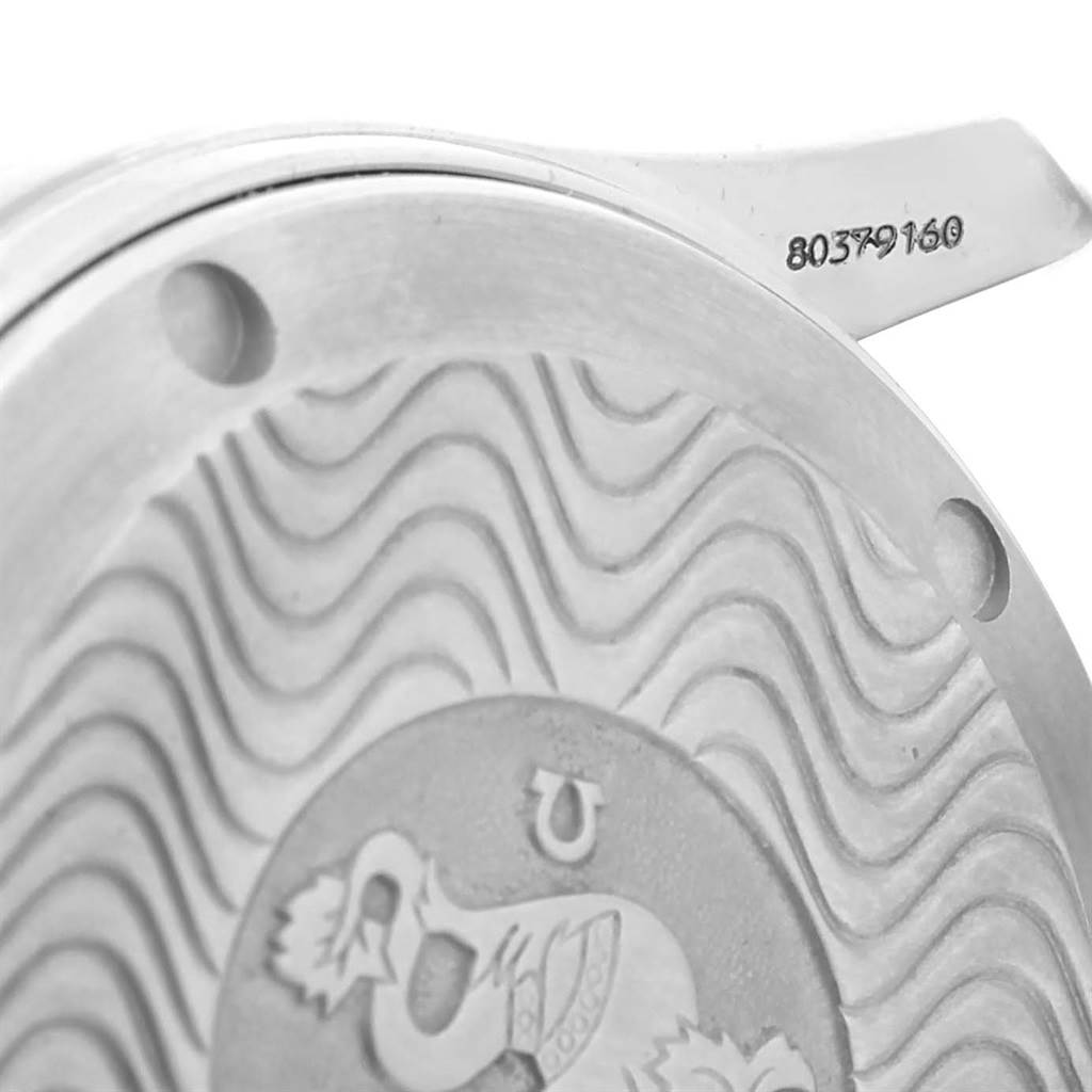 The image shows a close-up of the back case and lug of the Omega Seamaster 2551.80.00 Men
s Stainless Steel Blue Dial 2551.80.00 Men
s Stainless Steel Blue Dial watch, highlighting the wavy pattern and engraved details.