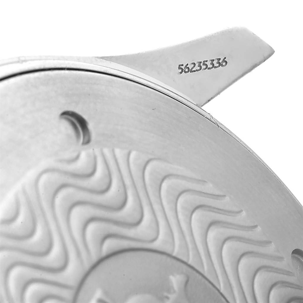 This image shows a close-up of the back cover of an Omega Seamaster 2541.80.00 Men
s Stainless Steel Blue Dial 2541.80.00 Men
s Stainless Steel Blue Dial watch, highlighting the serial number and part of the wave pattern.