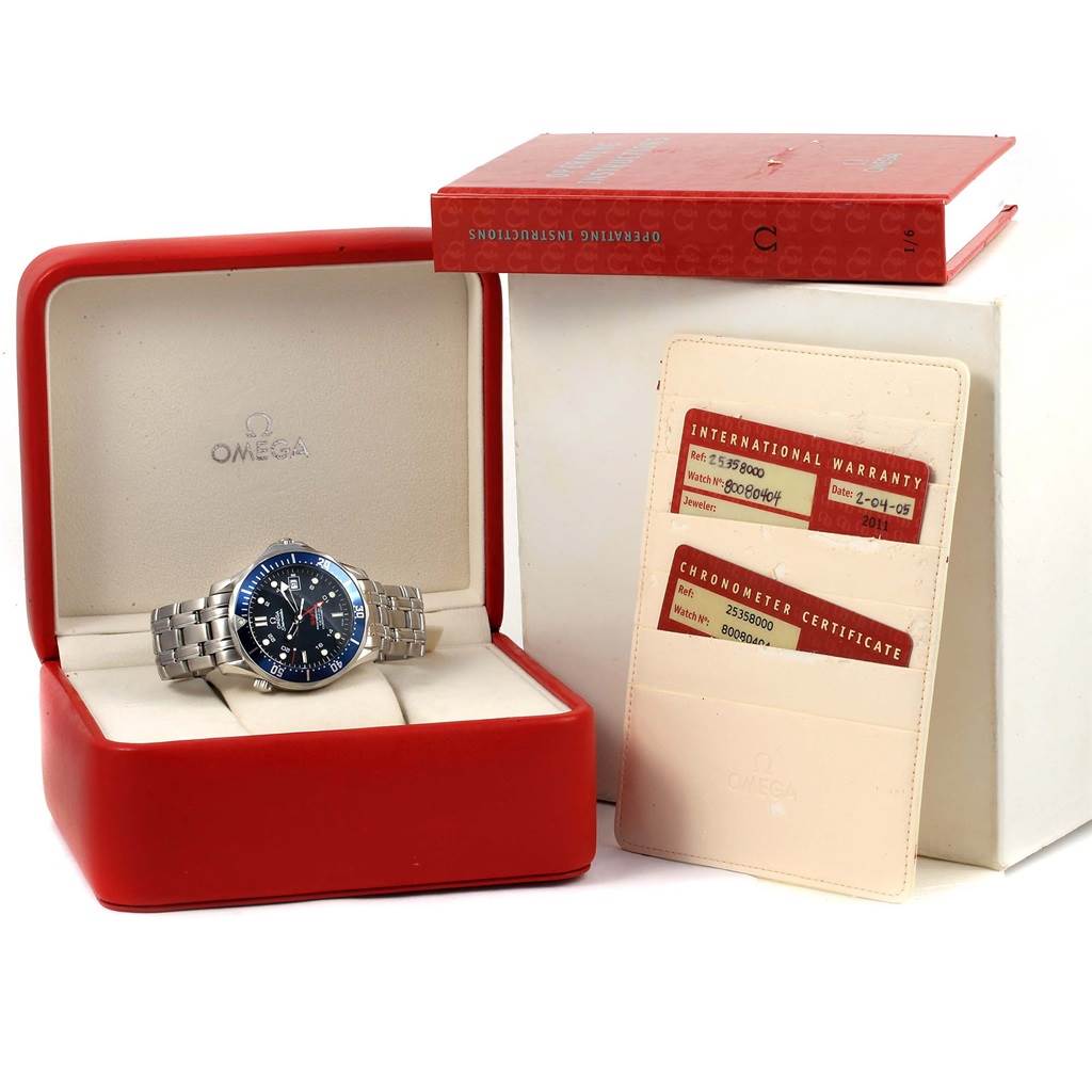 The Omega Seamaster 2535.80.00 Men
s Stainless Steel Blue Dial 2535.80.00 Men
s Stainless Steel Blue Dial watch is shown in its box, accompanied by an international warranty card, a chronometer certificate, and an instruction manual.
