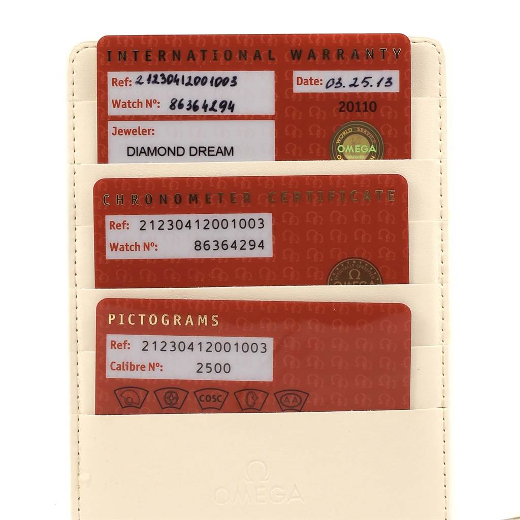 The image shows three warranty and certification cards for an Omega Seamaster 212.30.41.20.01.003 Men
s Stainless Steel Black Dial 212.30.41.20.01.003 Men
s Stainless Steel Black Dial watch, placed in a cream-colored holder.