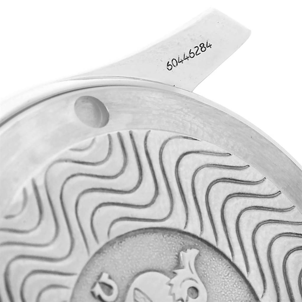 The image shows a close-up, angled view of the Omega Seamaster 2551.80.00 Men
s Stainless Steel Blue Dial 2551.80.00 Men
s Stainless Steel Blue Dial watch case back and part of the serial number.