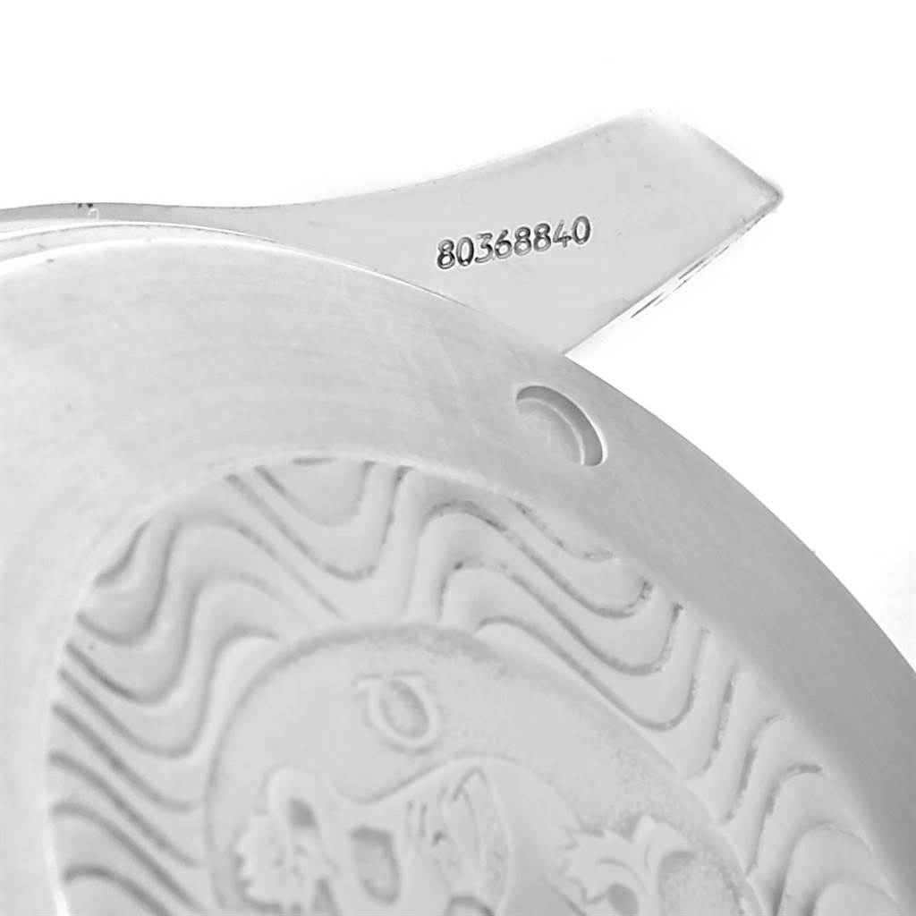 The image shows the back casing of an Omega Seamaster 2599.80.00 Men
s Stainless Steel Blue Dial 2599.80.00 Men
s Stainless Steel Blue Dial watch, focusing on the serial number and part of the engraving.