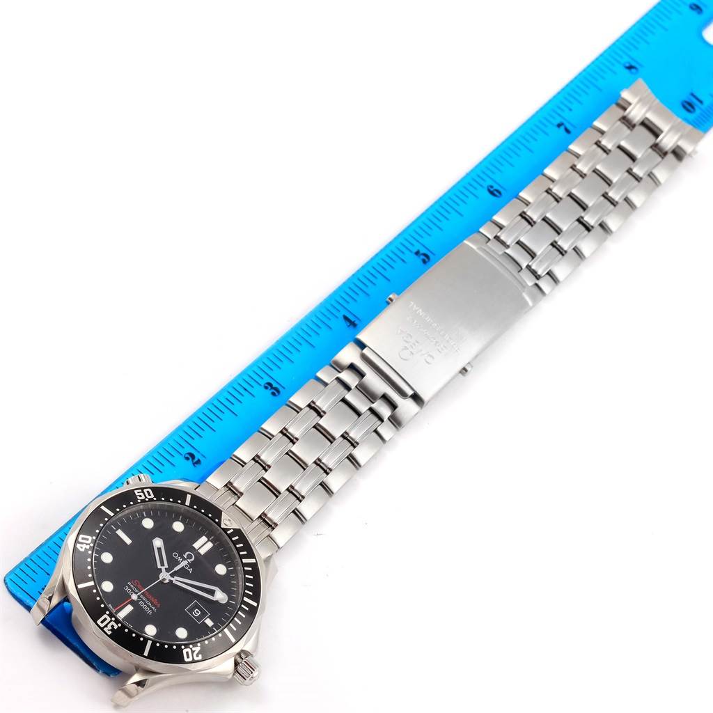 The image shows an Omega Seamaster 212.30.41.61.01.001 Men
s Stainless Steel Black Dial 212.30.41.61.01.001 Men
s Stainless Steel Black Dial watch with a ruler, displaying the entire face, bracelet, and clasp.