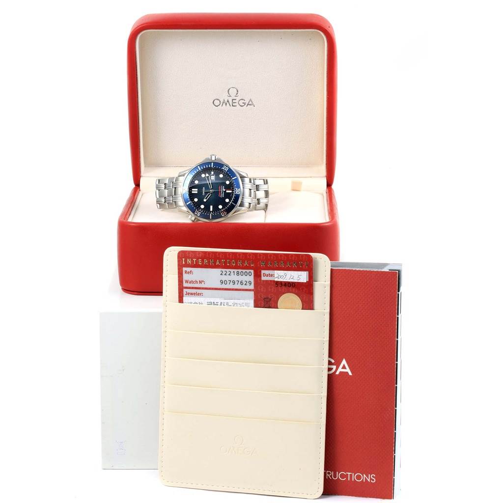 The Omega Seamaster 2221.80.00 Men
s Stainless Steel Blue Dial 2221.80.00 Men
s Stainless Steel Blue Dial watch is shown in its box with warranty cards and instruction manual in the foreground.