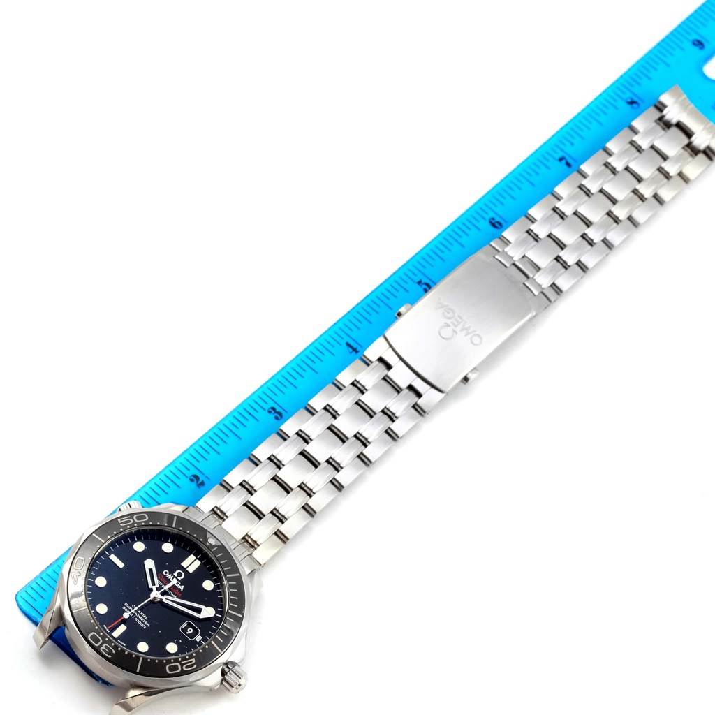 The image shows an Omega Seamaster 212.30.41.20.01.003 Men
s Stainless Steel Black Dial 212.30.41.20.01.003 Men
s Stainless Steel Black Dial watch, featuring its face and stainless steel bracelet with a ruler for size reference.