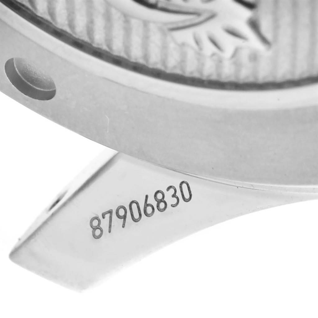 This image shows a close-up of the serial number and part of the case back and lug of the Omega Seamaster 212.30.41.20.01.003 Men
s Stainless Steel Black Dial 212.30.41.20.01.003 Men
s Stainless Steel Black Dial watch.