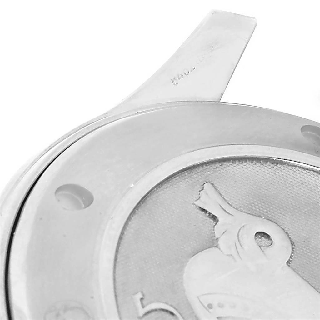 This image shows a close-up of the Omega Seamaster 212.30.41.20.01.002 Men
s Stainless Steel Black Dial 212.30.41.20.01.002 Men
s Stainless Steel Black Dial
s case back with part of its unique engraving.