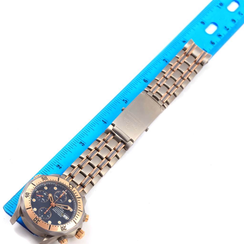 The image shows an Omega Seamaster 2296.80.00 Titanium Blue Dial 2296.80.00 Titanium Blue Dial watch laid flat against a ruler, displaying the watch face, bezel, and entire metal bracelet.