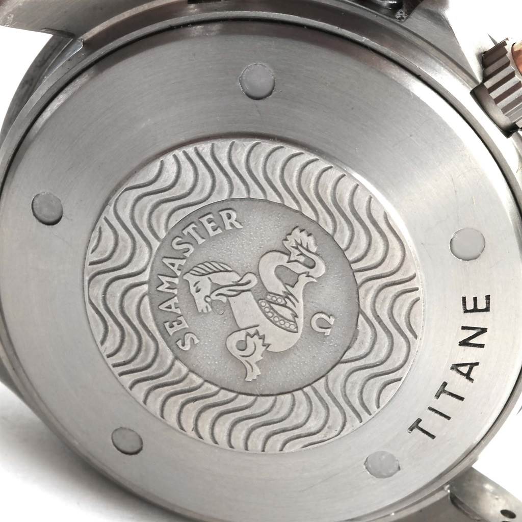 The image shows the case back of an Omega Seamaster 2296.80.00 Titanium Blue Dial 2296.80.00 Titanium Blue Dial watch, featuring the brand logo and "TITANE" inscription.