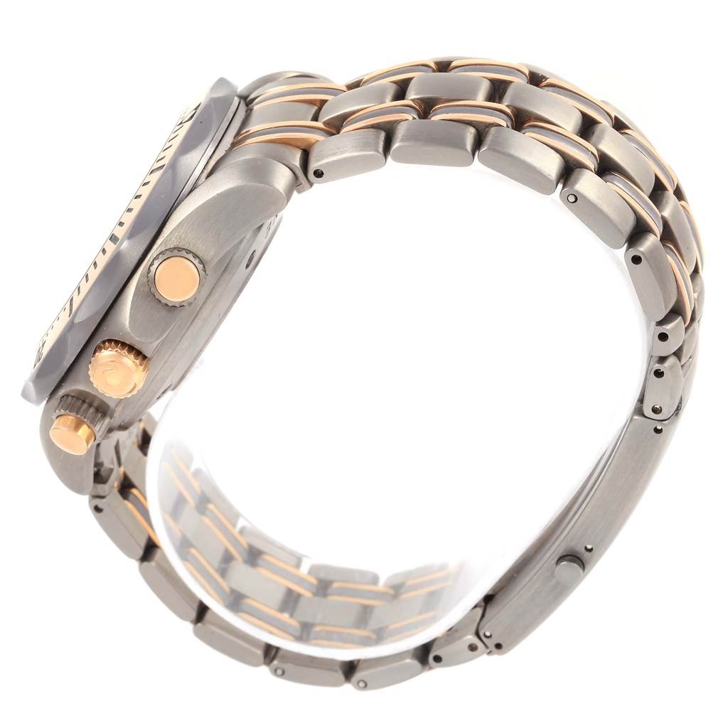 The image shows a side view of the Omega Seamaster 2296.80.00 Titanium Blue Dial 2296.80.00 Titanium Blue Dial watch, focusing on the metal bracelet and the watch's crown and pushers.