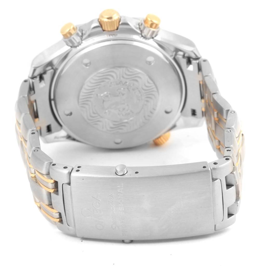 The image shows the back case and clasp of an Omega Seamaster 2398.80.00 Men's Steel and Gold (two tone) Blue Dial 2398.80.00 Men's Steel and Gold (two tone) Blue Dial watch, highlighting its bracelet and case back engravings.