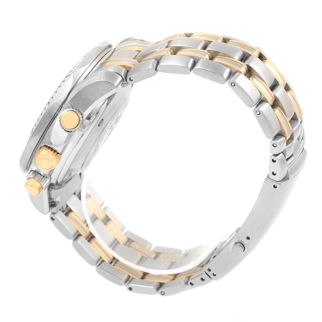 The image shows a side view of the Omega Seamaster 2398.80.00 Men's Steel and Gold (two tone) Blue Dial 2398.80.00 Men's Steel and Gold (two tone) Blue Dial watch, highlighting its gold and silver bracelet and the crown.