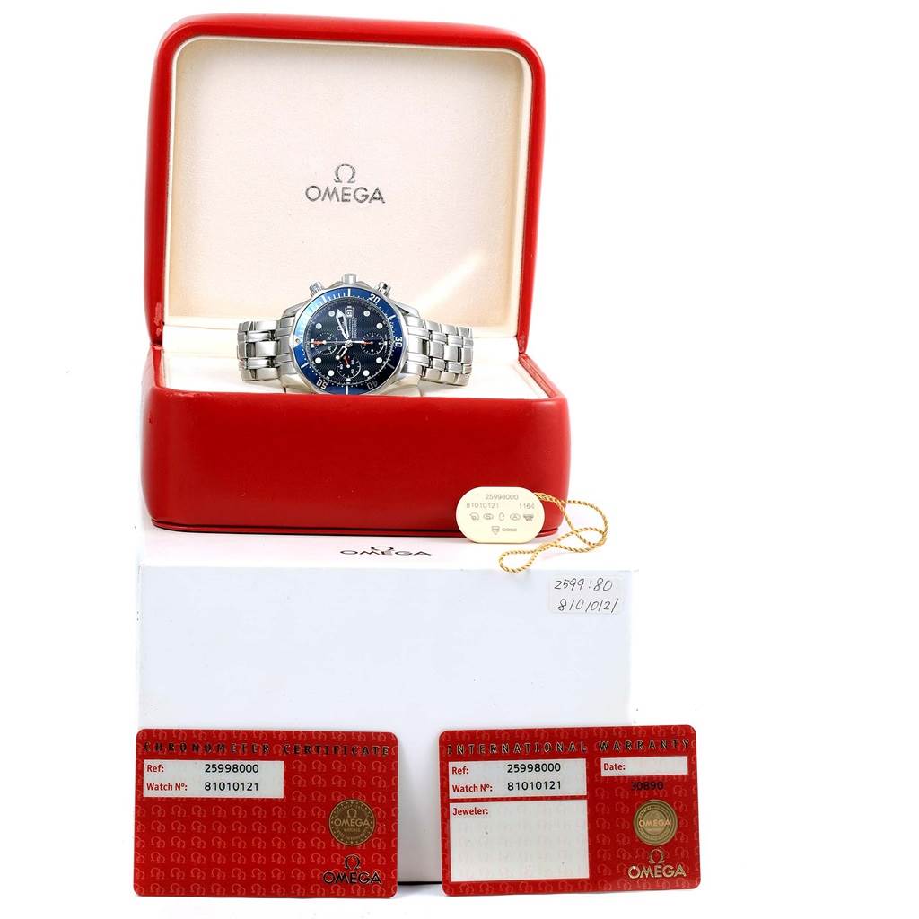 The Omega Seamaster 2599.80.00 Men's Stainless Steel Blue Dial 2599.80.00 Men's Stainless Steel Blue Dial watch is displayed at a front angle inside its red box, along with two warranty cards and a tag.