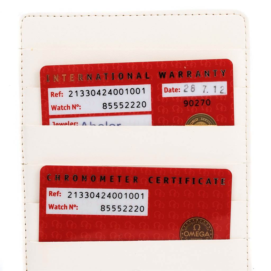 The image shows the international warranty and chronometer certificate cards for an Omega Seamaster 213.30.42.40.01.001 Men
s Stainless Steel Black Dial 213.30.42.40.01.001 Men
s Stainless Steel Black Dial watch.