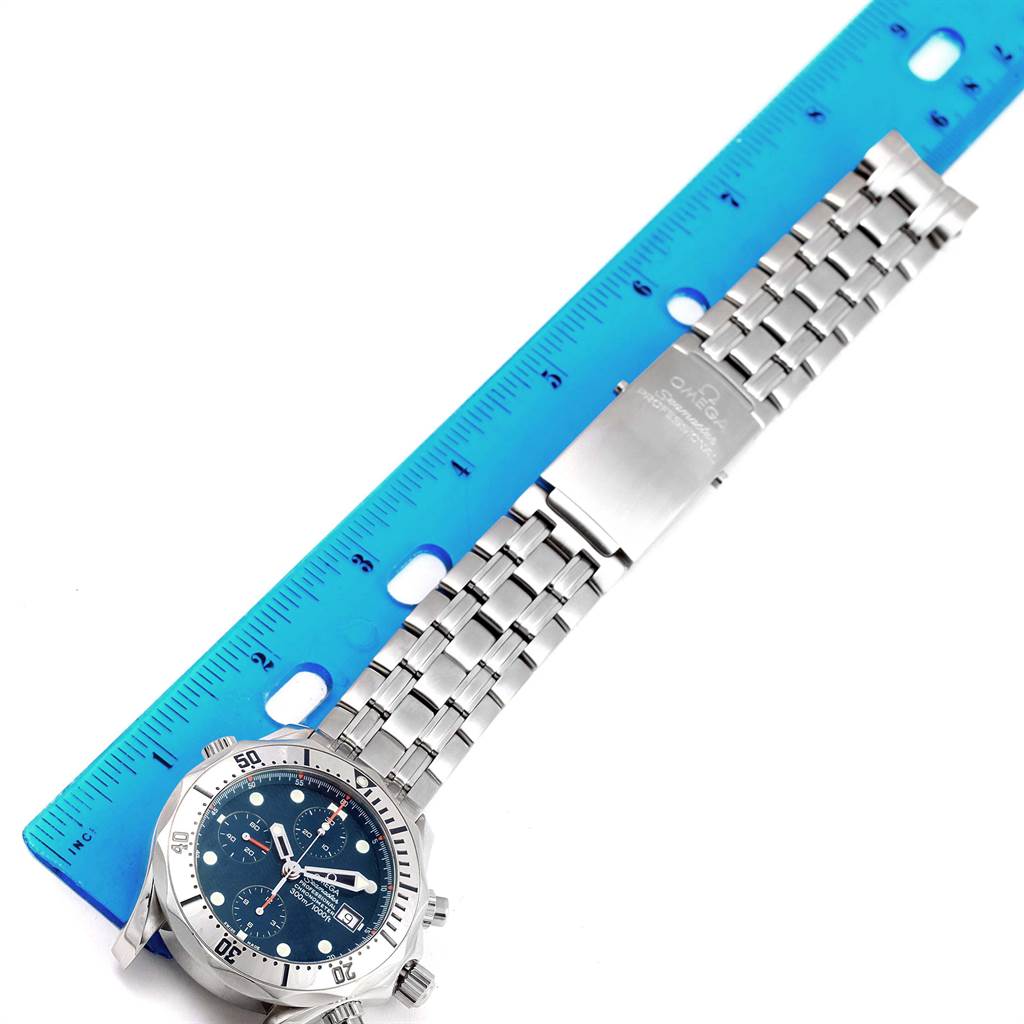 The image shows a top view of an Omega Seamaster 2598.80.00 Men
s Stainless Steel Blue Dial 2598.80.00 Men
s Stainless Steel Blue Dial watch with a ruler for scale, highlighting the watch face and metal bracelet.