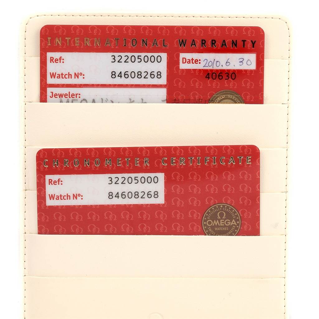 The image shows the International Warranty and Chronometer Certificate cards for an Omega Seamaster 3220.50.00 Men's Stainless Steel Black Dial 3220.50.00 Men's Stainless Steel Black Dial watch.