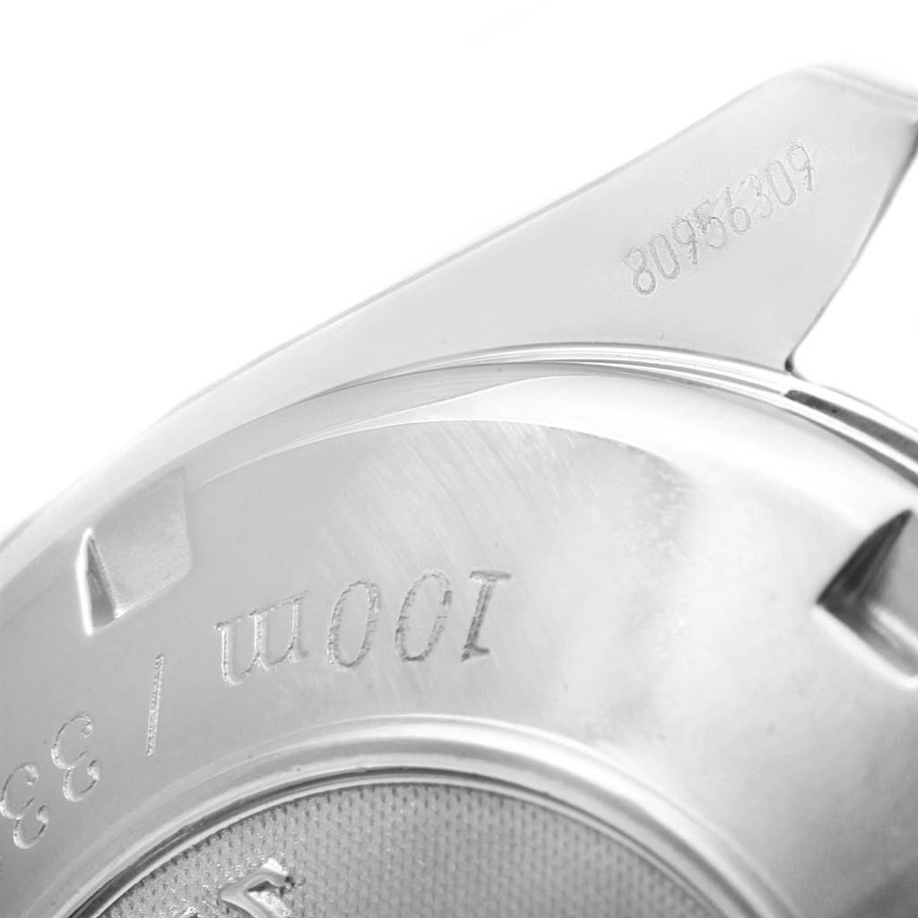 This image shows a close-up of the case back and serial number of an Omega Seamaster 323.30.40.40.01.001 Men's Stainless Steel Black Dial 323.30.40.40.01.001 Men's Stainless Steel Black Dial watch.