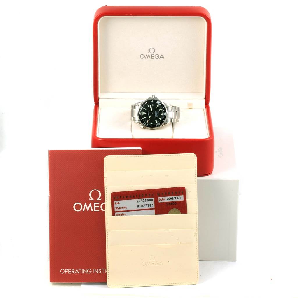 The Omega Seamaster 2252.50.00 Men's Stainless Steel Black Dial 2252.50.00 Men's Stainless Steel Black Dial watch is displayed in an open red case, with the operating instructions and warranty card holder in front.