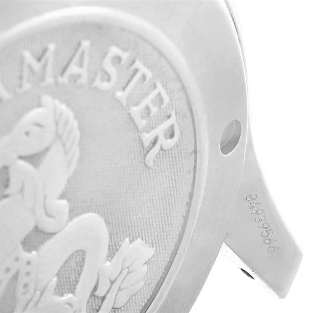 The image shows a close-up of the back case of an Omega Seamaster 2220.80.00 Men
s Stainless Steel Blue Dial 2220.80.00 Men
s Stainless Steel Blue Dial watch, emphasizing its embossed design and serial number.