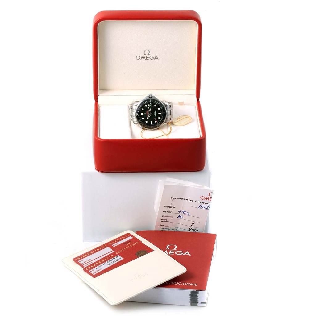 The image shows an Omega Seamaster 212.30.41.20.01.003 Men
s Stainless Steel Black Dial 212.30.41.20.01.003 Men
s Stainless Steel Black Dial watch in its open red box, accompanied by instruction manuals and warranty cards.