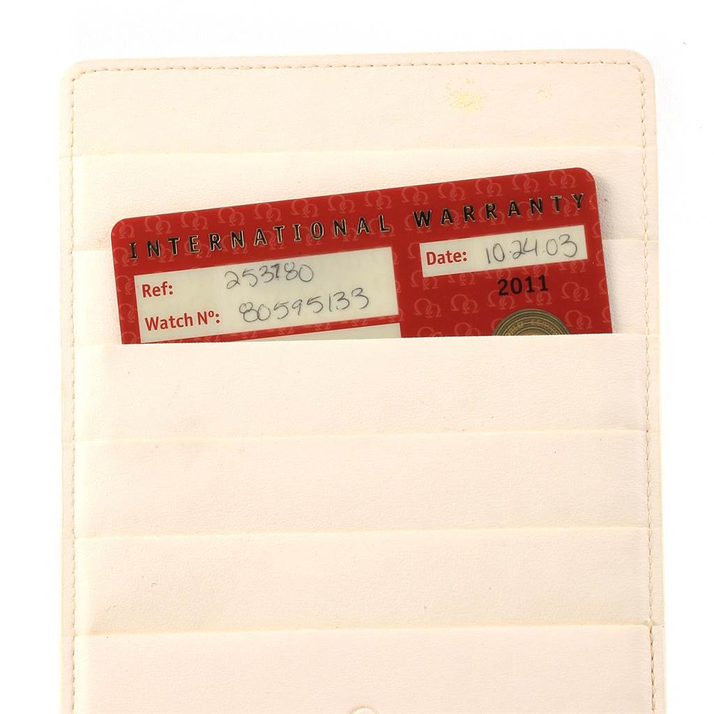 The image shows an international warranty card for the Omega Seamaster 2537.80.00 Men
s Stainless Steel Blue Dial 2537.80.00 Men
s Stainless Steel Blue Dial watch, partially inserted into a white card holder.