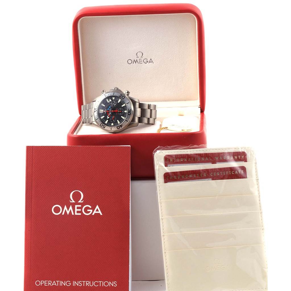 The Omega Seamaster 2269.52.00 Men's Titanium Black Dial 2269.52.00 Men's Titanium Black Dial watch is displayed in its box alongside the operating instructions and warranty cards.
