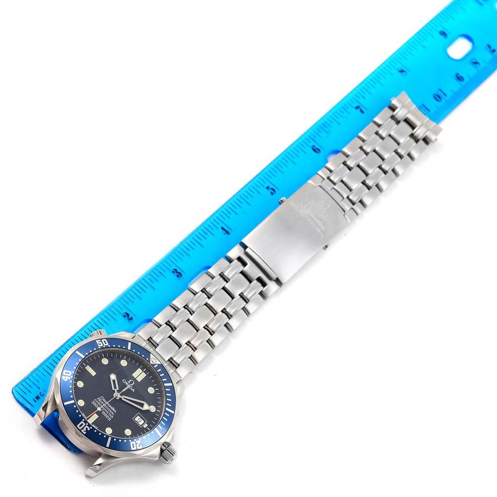 This image shows the entirety of the Omega Seamaster 2531.80.00 Men
s Stainless Steel Blue Dial 2531.80.00 Men
s Stainless Steel Blue Dial watch, laid flat against a ruler for measurement.