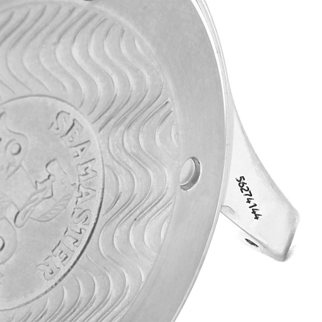 This is a close-up of the case back of an Omega Seamaster 2541.80.00 Men
s Stainless Steel Blue Dial 2541.80.00 Men
s Stainless Steel Blue Dial watch, showing engraved patterns and partial serial number.