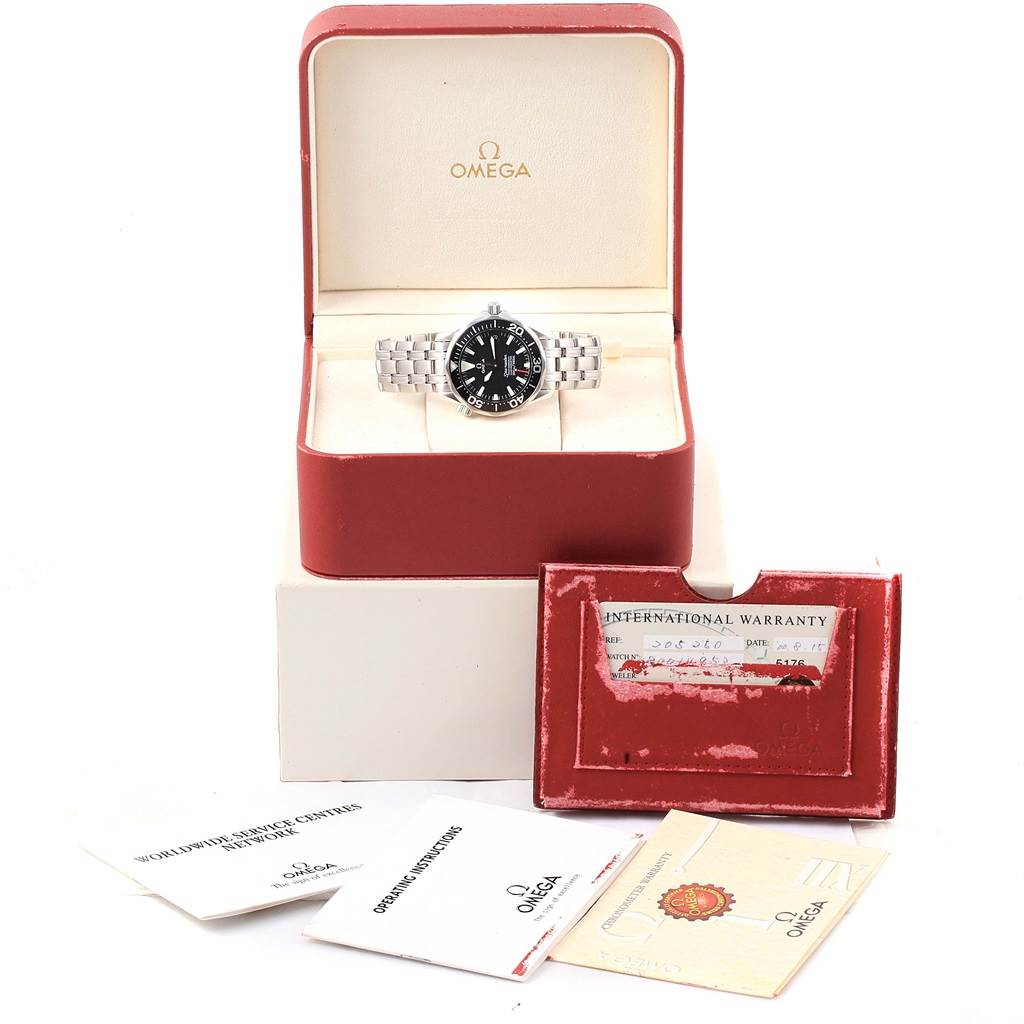 The Omega Seamaster 2252.50.00 Men's Stainless Steel Black Dial 2252.50.00 Men's Stainless Steel Black Dial watch is displayed in its open case with warranty cards and instructional booklets shown.