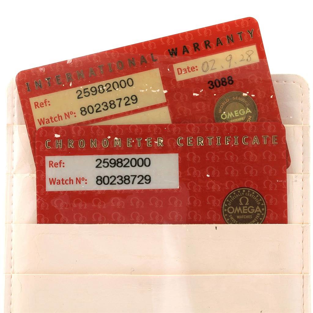 The image shows the international warranty and chronometer certificate cards for an Omega Seamaster 2598.20.00 Men
s Stainless Steel White Dial 2598.20.00 Men
s Stainless Steel White Dial watch.