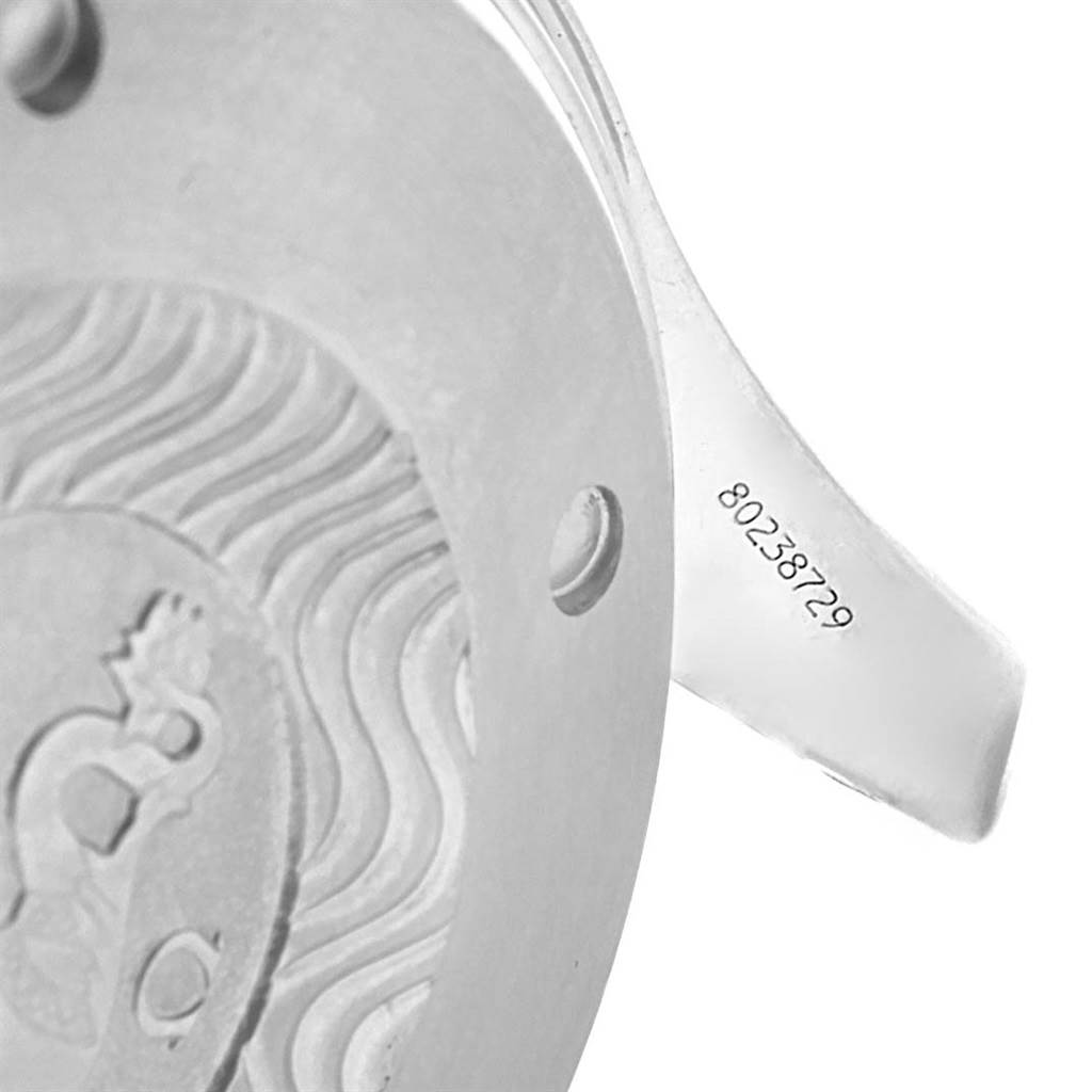 The image shows a close-up of the back case and part of the lugs of an Omega Seamaster 2598.20.00 Men
s Stainless Steel White Dial 2598.20.00 Men
s Stainless Steel White Dial watch, featuring an engraved design and serial number.