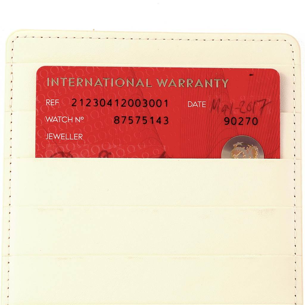 The image shows an international warranty card for a Seamaster model by Omega inside a beige cardholder.
