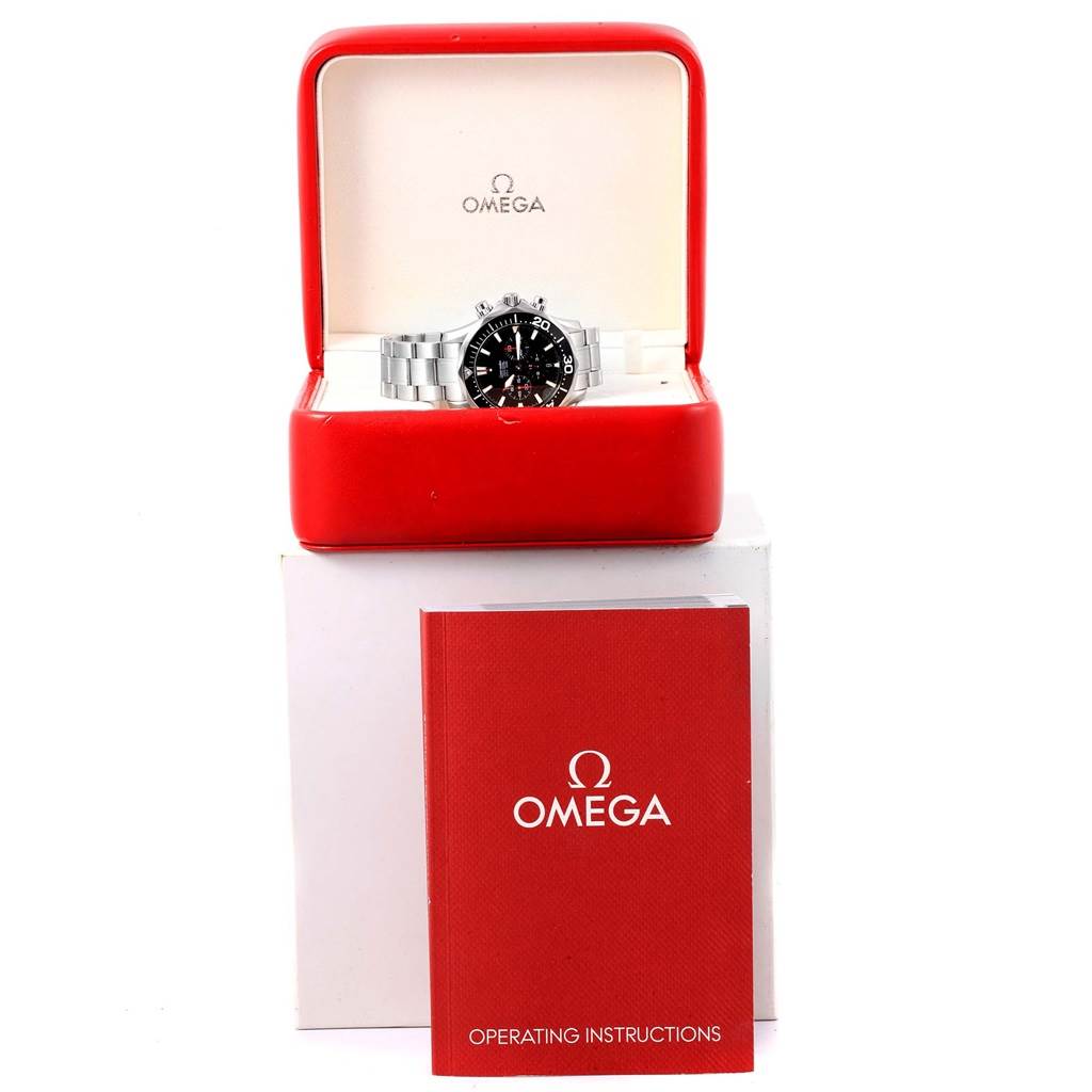 The Omega Seamaster 2594.52.00 Men
s Stainless Steel Black Dial 2594.52.00 Men
s Stainless Steel Black Dial watch is shown front-facing in its red box, with the operating instructions placed in front.