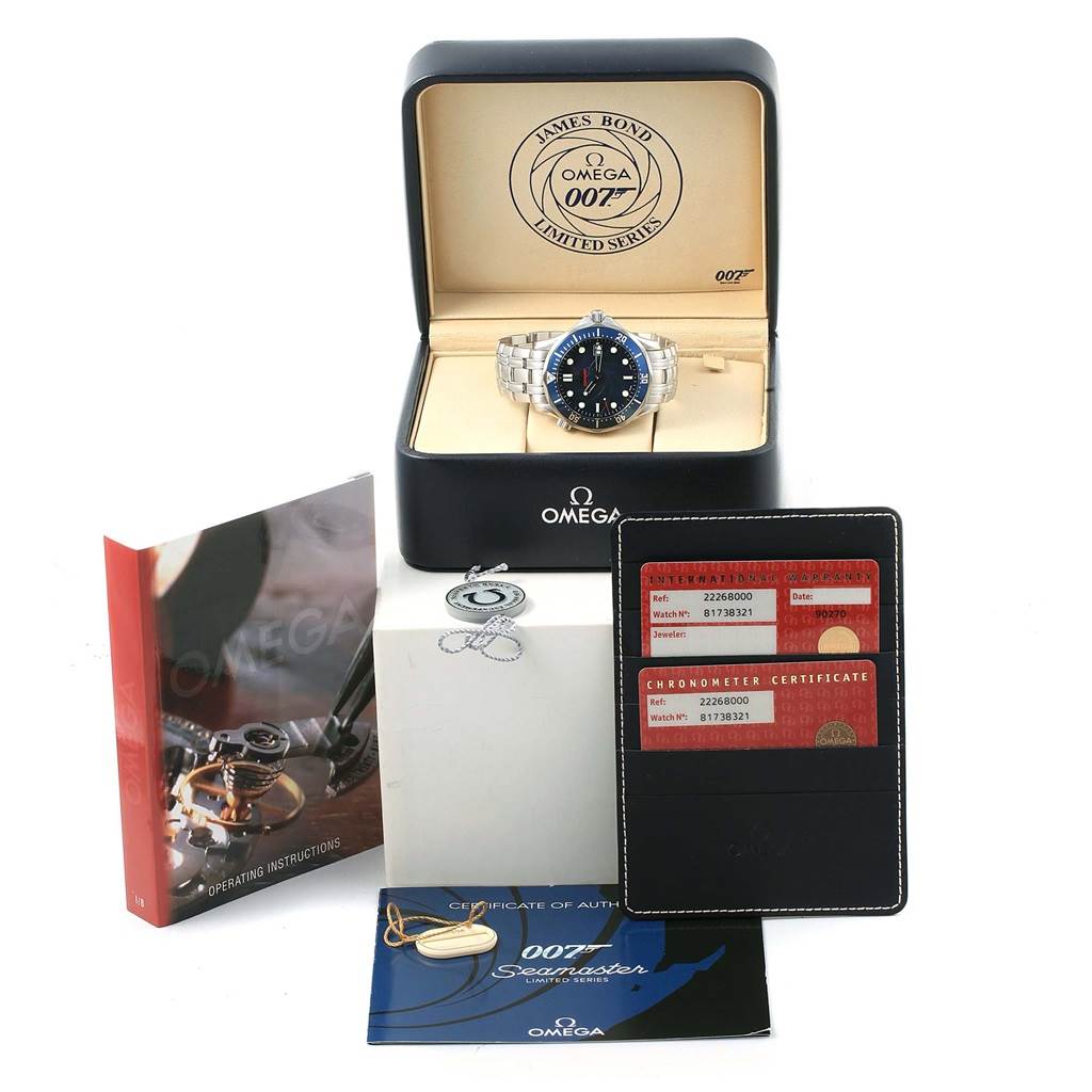 The Omega Seamaster 2226.80.00 Men's Stainless Steel Blue Dial 2226.80.00 Men's Stainless Steel Blue Dial watch is shown in its open case with booklets, authenticity cards, and a tag displayed around it.