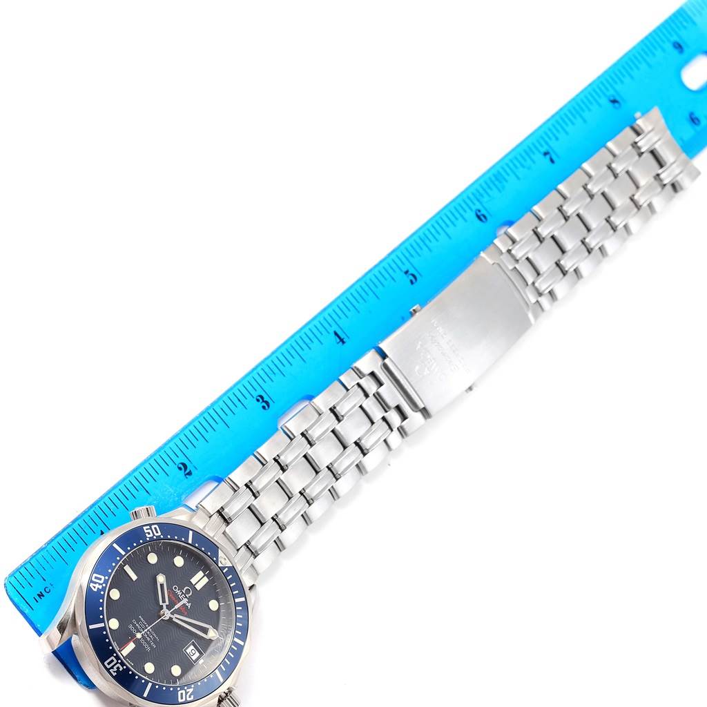 The image shows an Omega Seamaster 2220.80.00 Men
s Stainless Steel Blue Dial 2220.80.00 Men
s Stainless Steel Blue Dial watch laid flat next to a ruler, displaying the watch face and stainless steel bracelet.